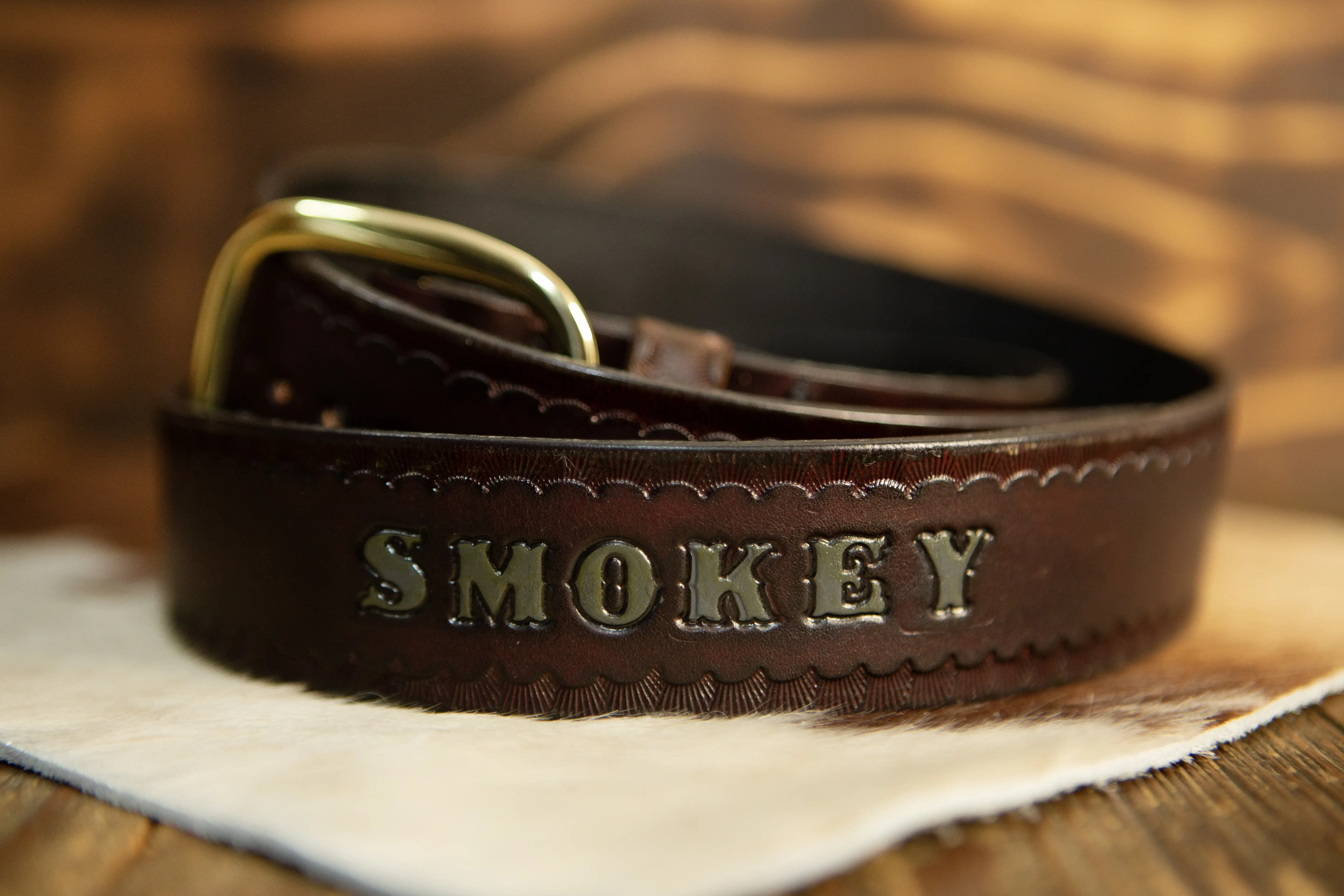 A custom hand tooled leather piece in progress on the workbench